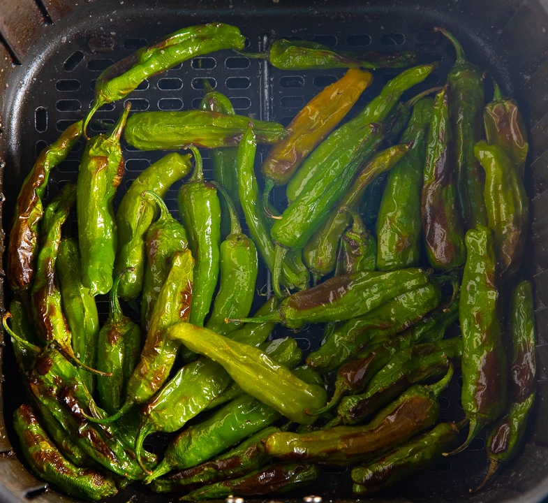 The roasted peppers in the air fryer basket