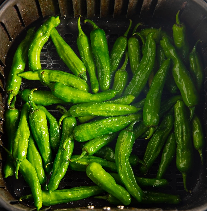 Raw peppers in the air fryer basket