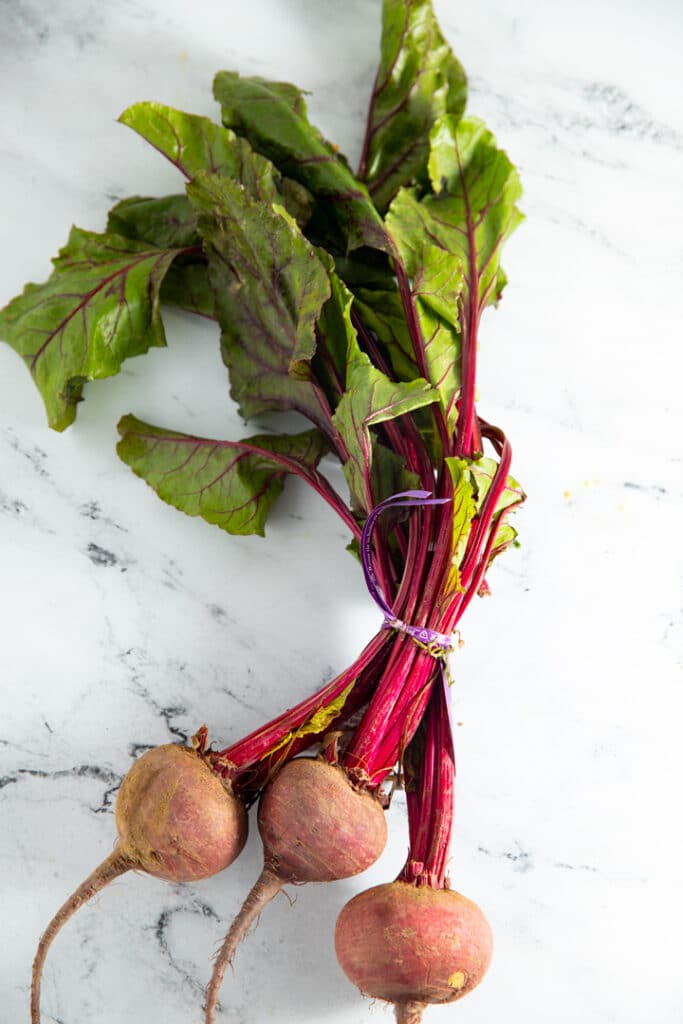 Fresh beets on a marble worktop