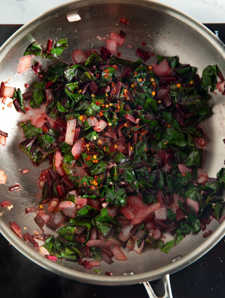 the beet green leaves added to the pan