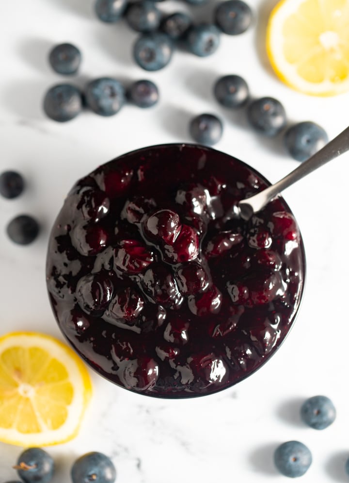 Blueberry compote served in a small bowl with a spoon