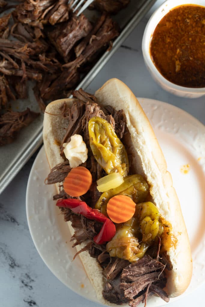 Italian beef in a roll with toppings