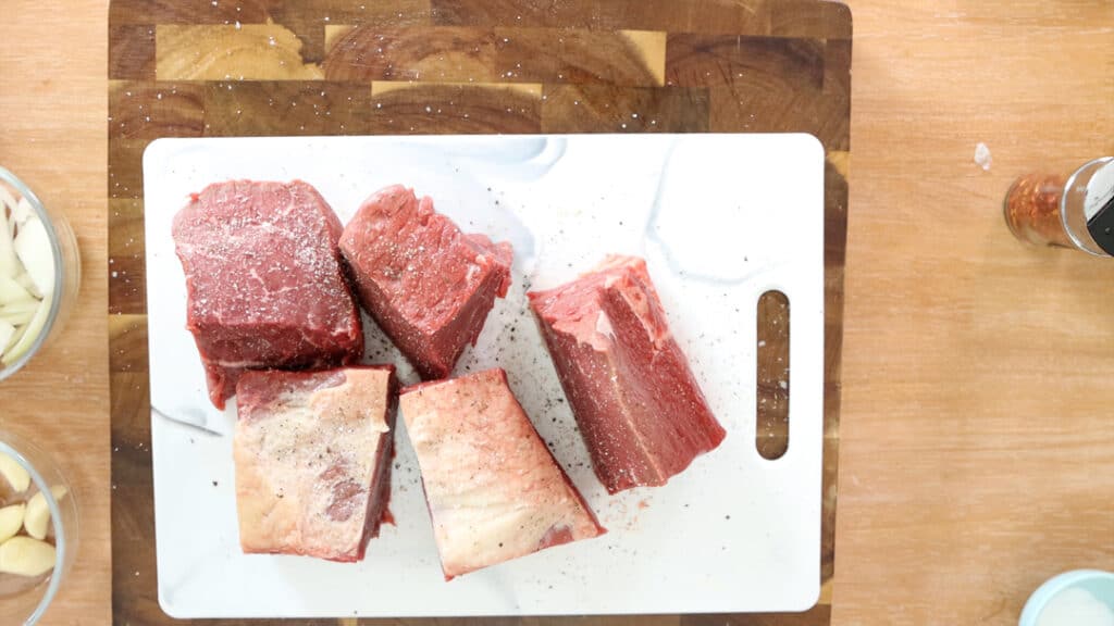 Beef on a white chopping board