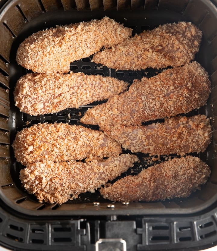 The breaded chicken in the air fryer basket