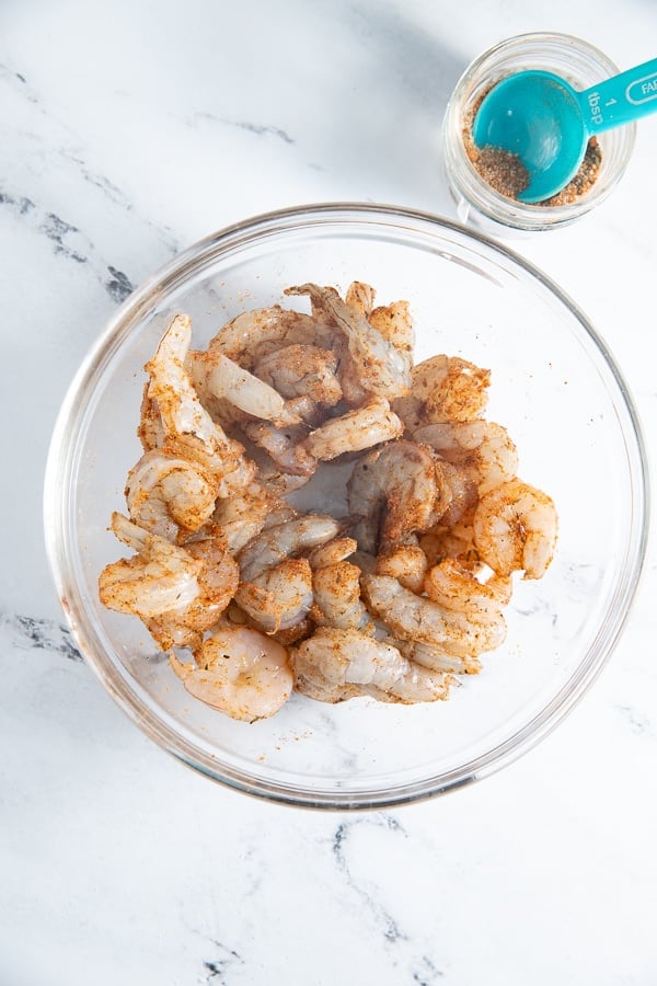 Shrimp in a glass bowl with the seasoning