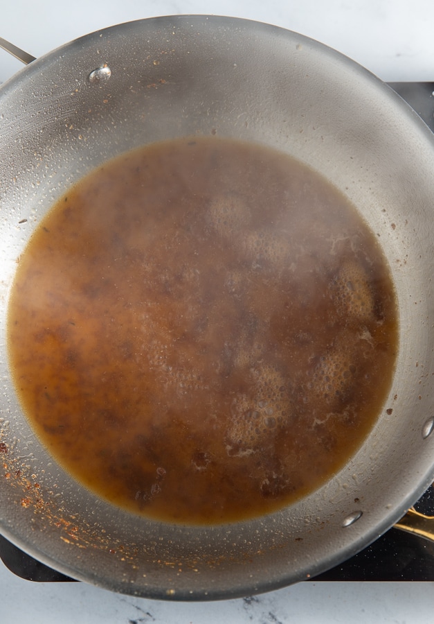 Pasta water added to the pan to deglaze it