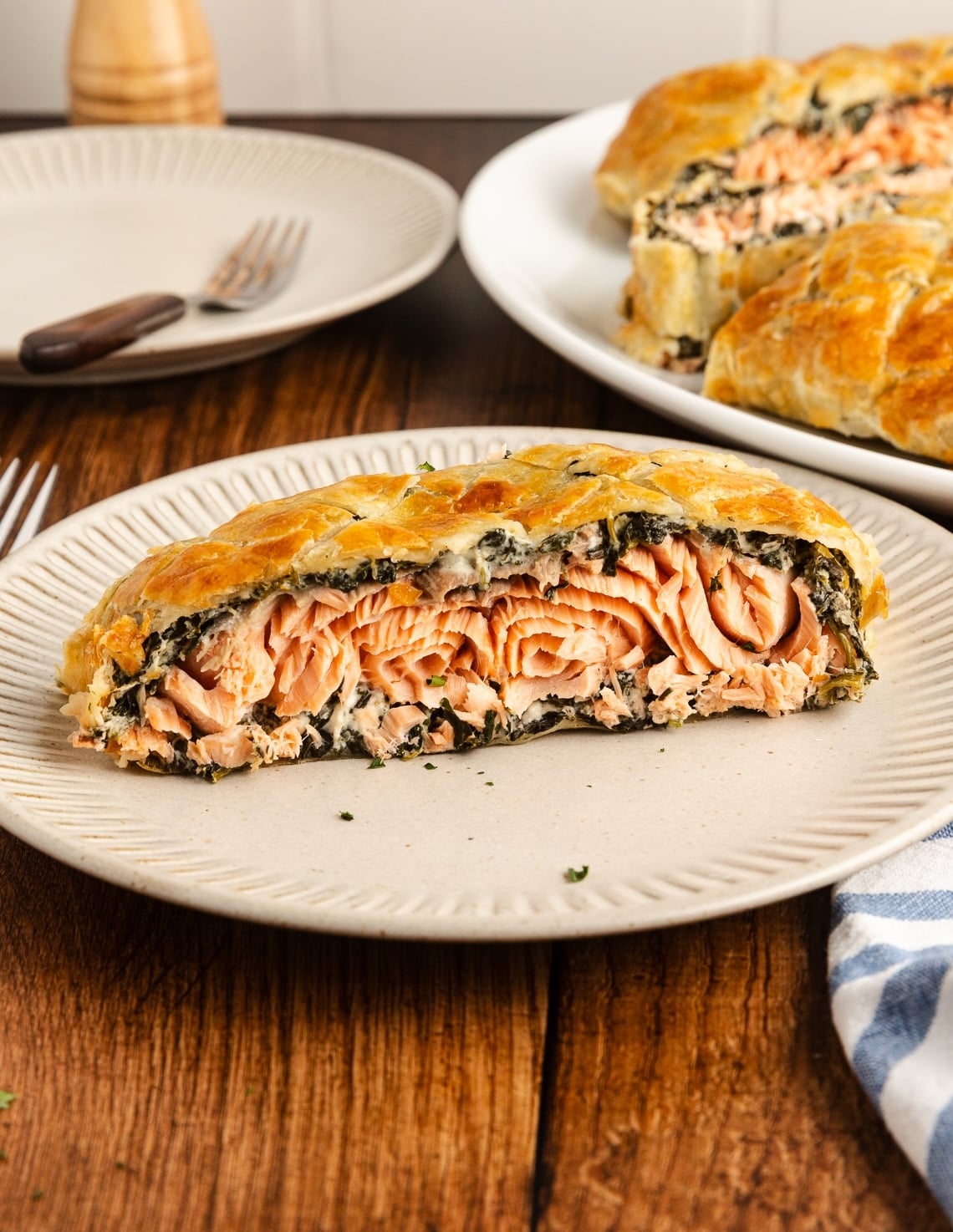 close up photo of salmon wellington cut on table