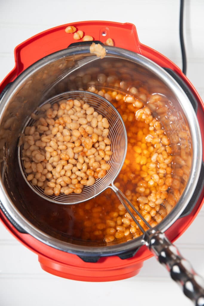 beans in pot with strainer