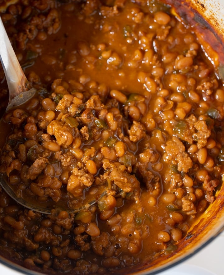 beans in a pot with spoon sticking out