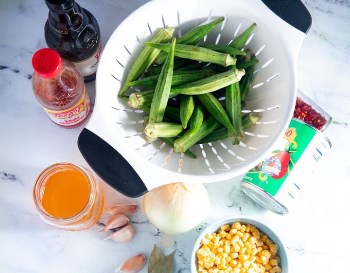 Ingredients to make stewed okra and tomatoes