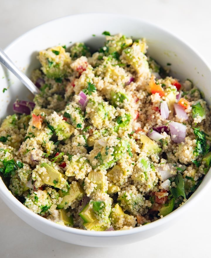 A fork in a bowl of the quinoa salad