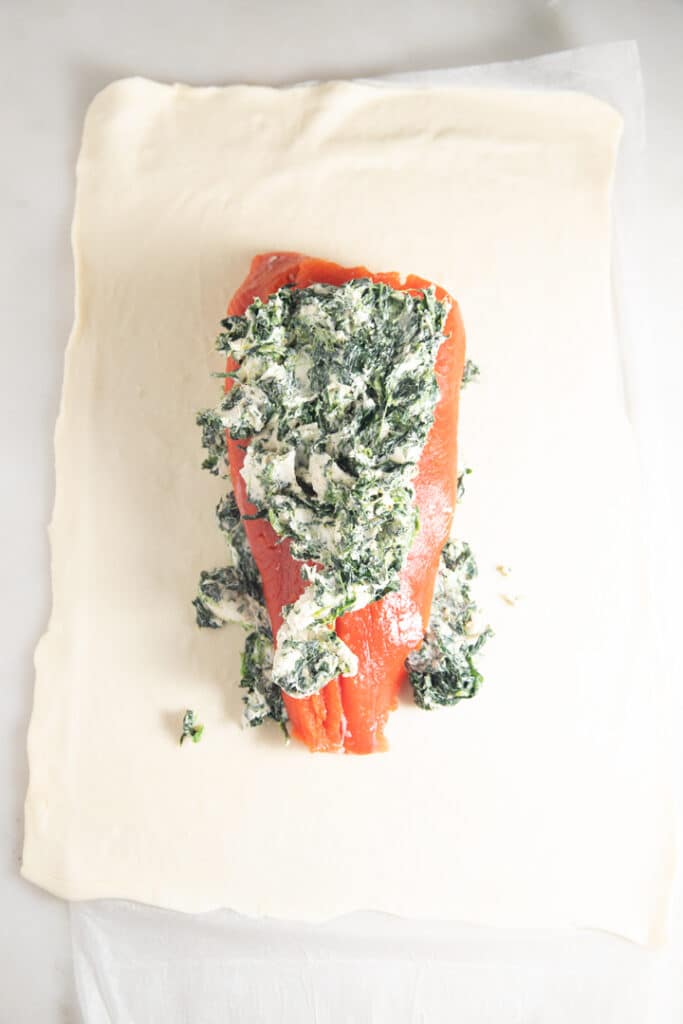 Cream cheese and pinach on top of the salmon fillet