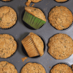 zucchini muffins laying in muffin tin