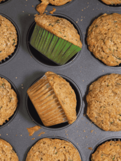 zucchini muffins laying in muffin tin