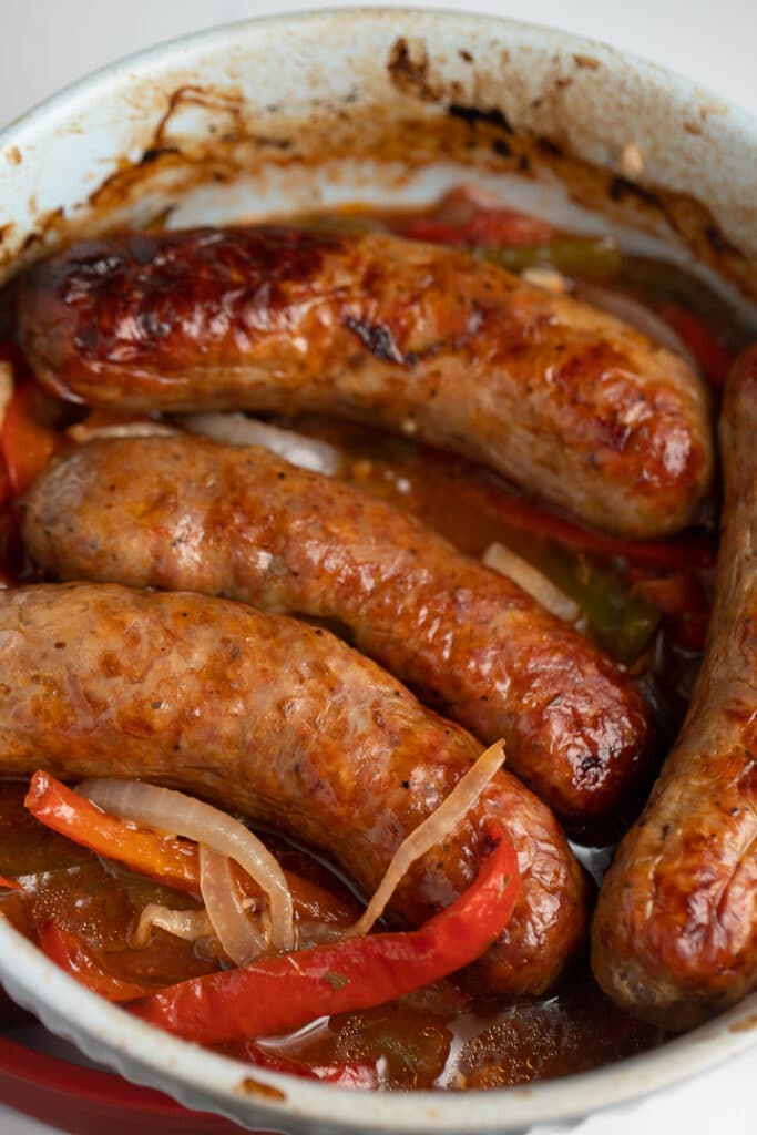 Air fried sausages on top of the cooked vegetables