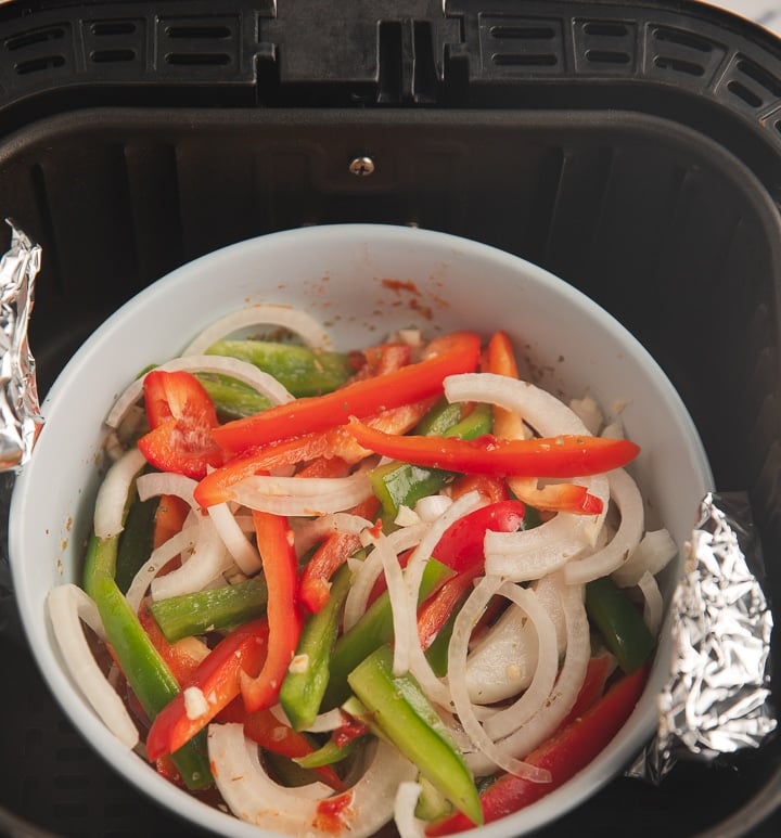 The bowl of vegetables in the air fryer