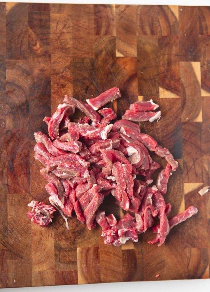 shopped steak on a cutting board