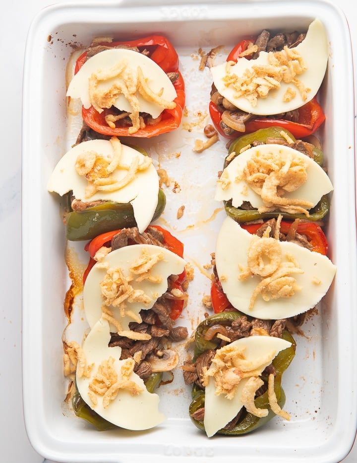 Cheese placed on top of the peppers