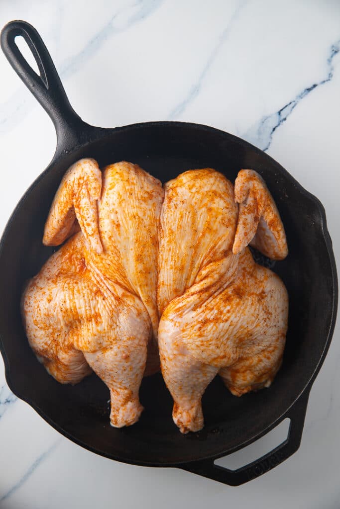 The chicken in a cast iron skillet