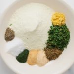 herbs and spices for ranch seasoning on a white plate