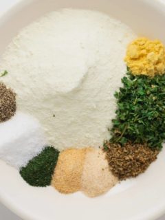 herbs and spices for ranch seasoning on a white plate