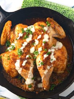 spatchcocked chicken in cast iron skillet