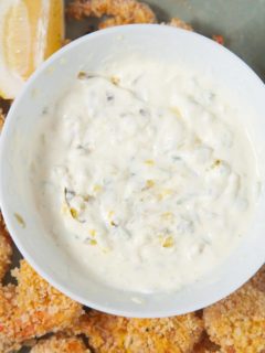 tartar sauce on plate surrounded by shrimp