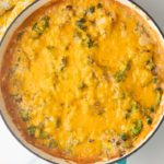 broccoli rice casserole in teal skillet