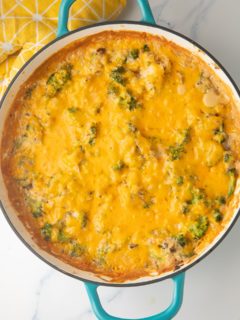 broccoli rice casserole in teal skillet