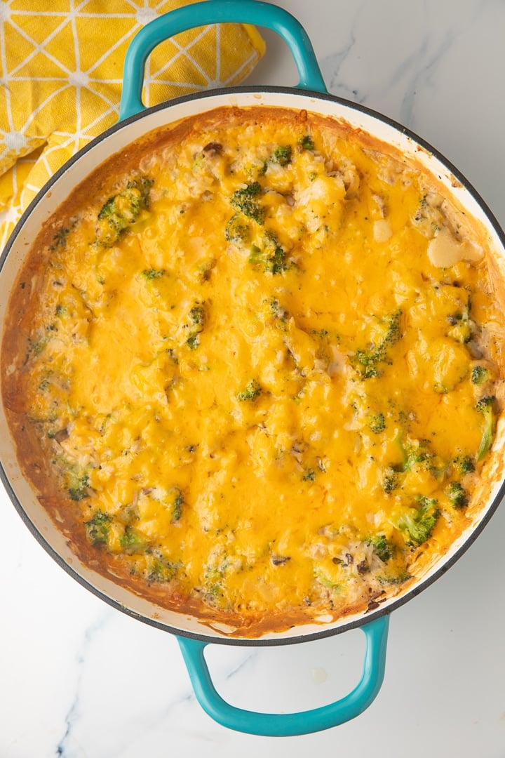 broccoli rice casserole in teal skillet