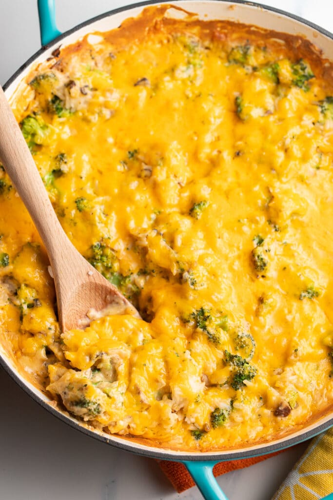 Overhead shot of the baked casserole with a wooden spoon