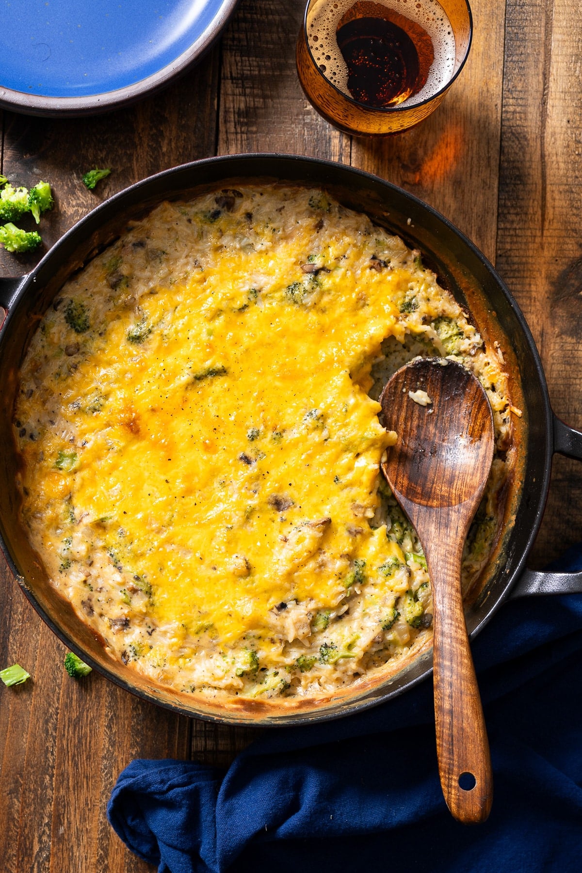 broccoli rice casserole in dish with spoon in it