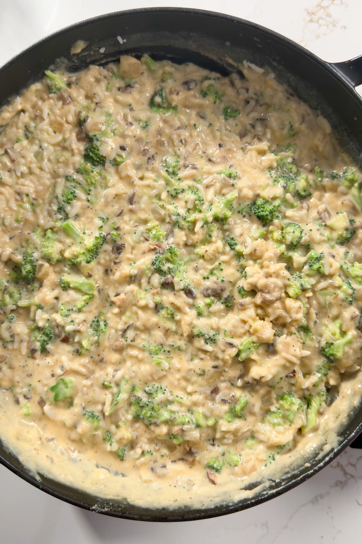 broccoli and rice and sauce in skillet