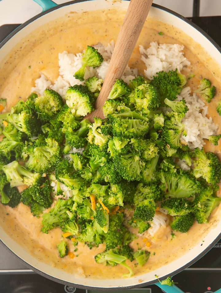 Broccoli and rice being added to the pot