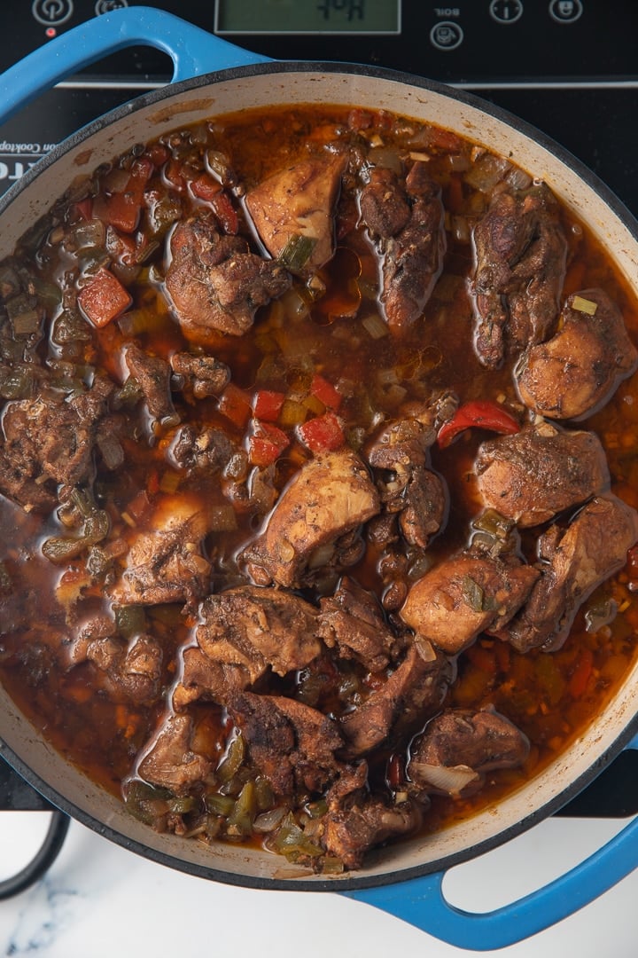 chicken pieces cooking in pot