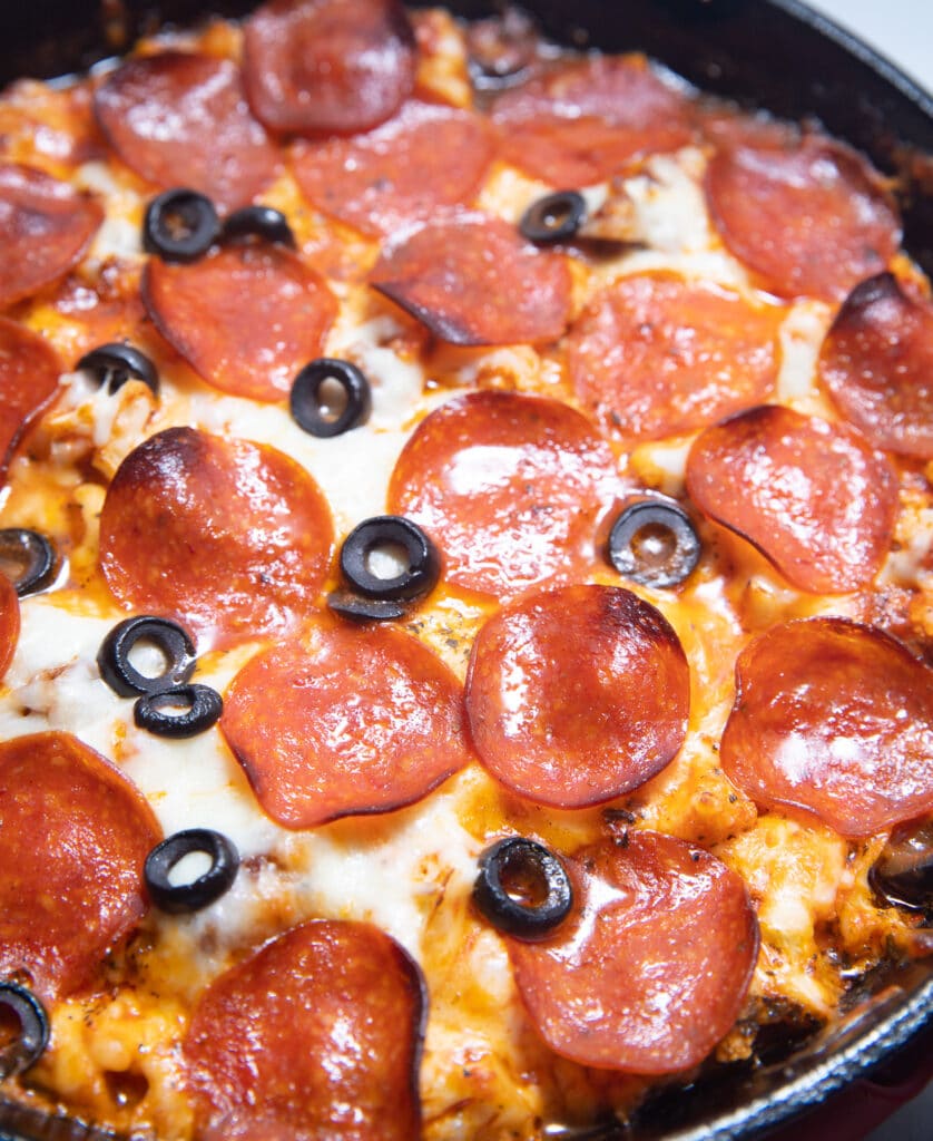 Close up of the toppings on the cauliflower pizza casserole.