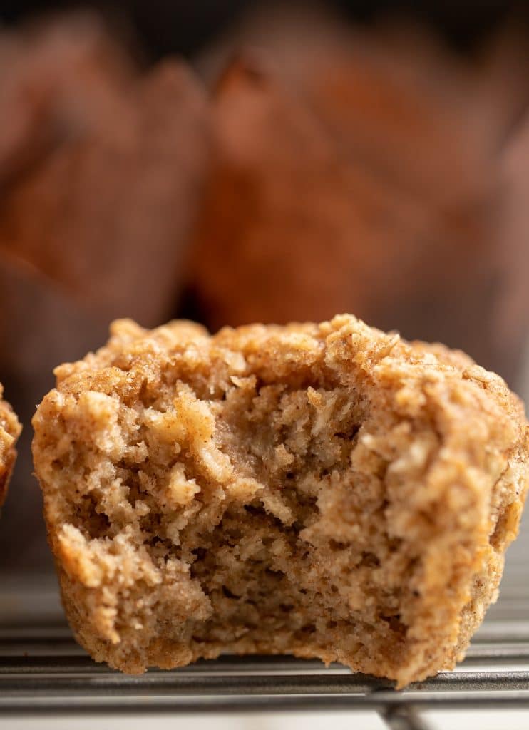 A bite taken out of an applesauce muffin.