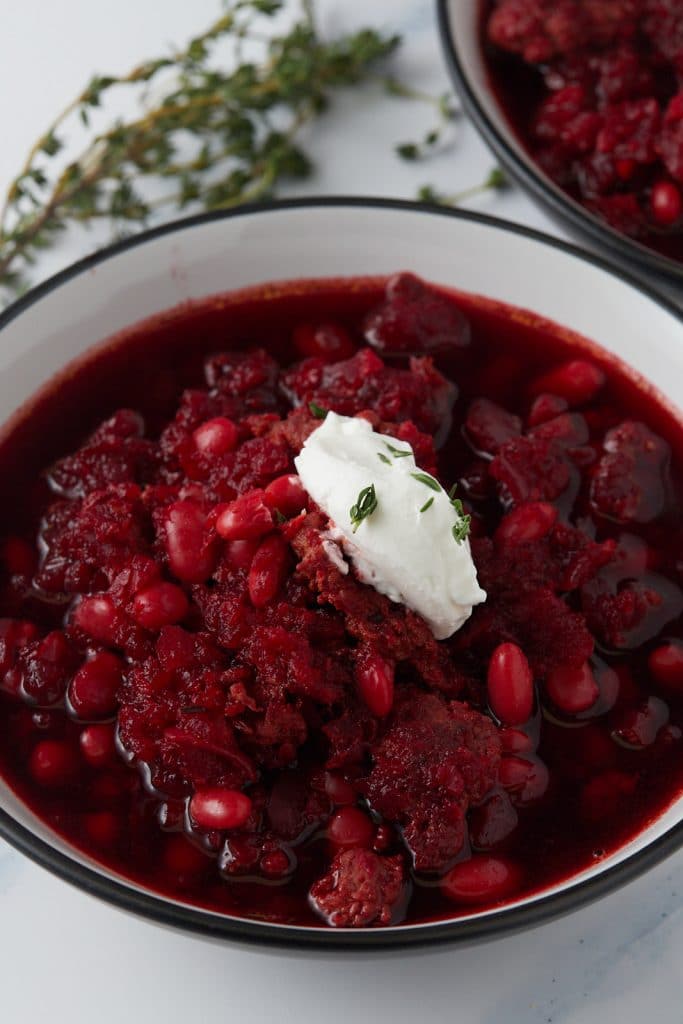 A dollop of sour cream on top of the soup.