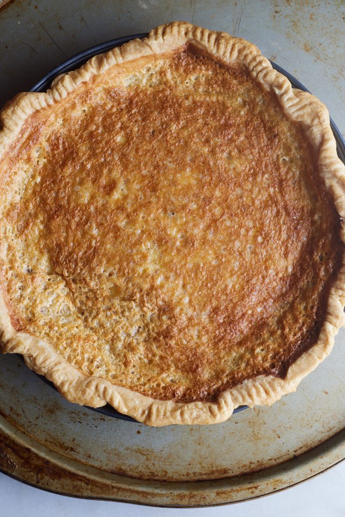 The baked chess pie on a baking sheet.