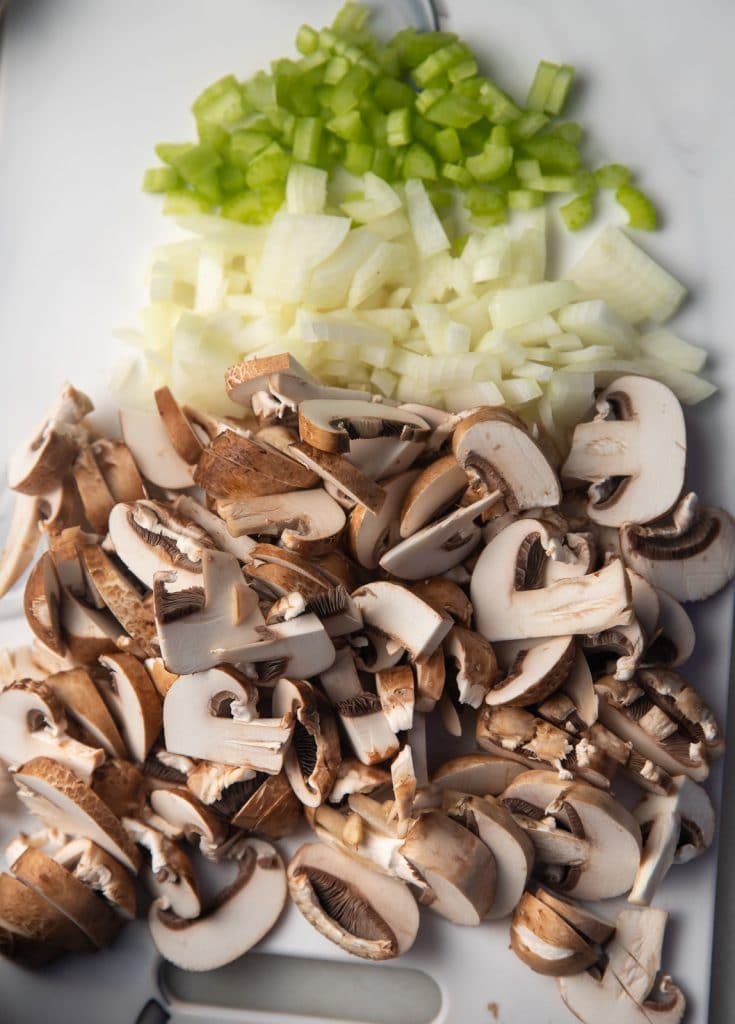 The chopped vegetables on a board.