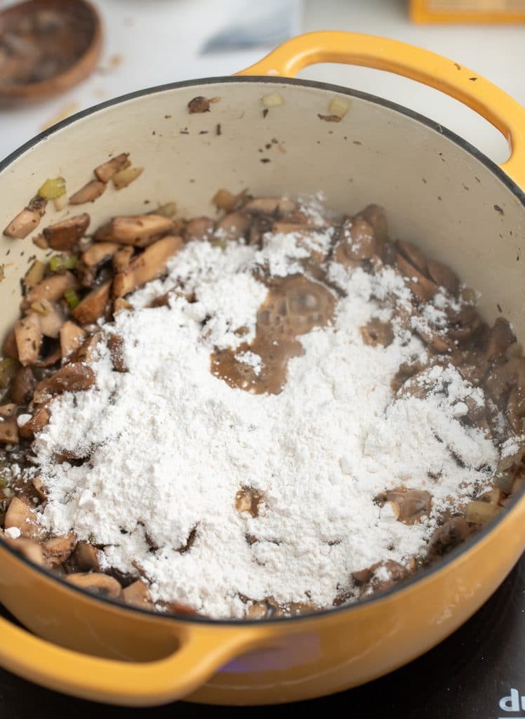 The flour mixture added to the mushrooms.