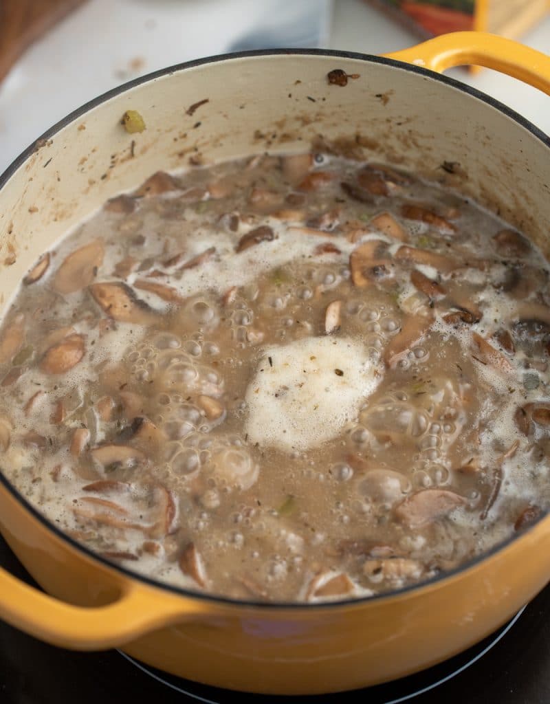 The soup simmering in the pot.