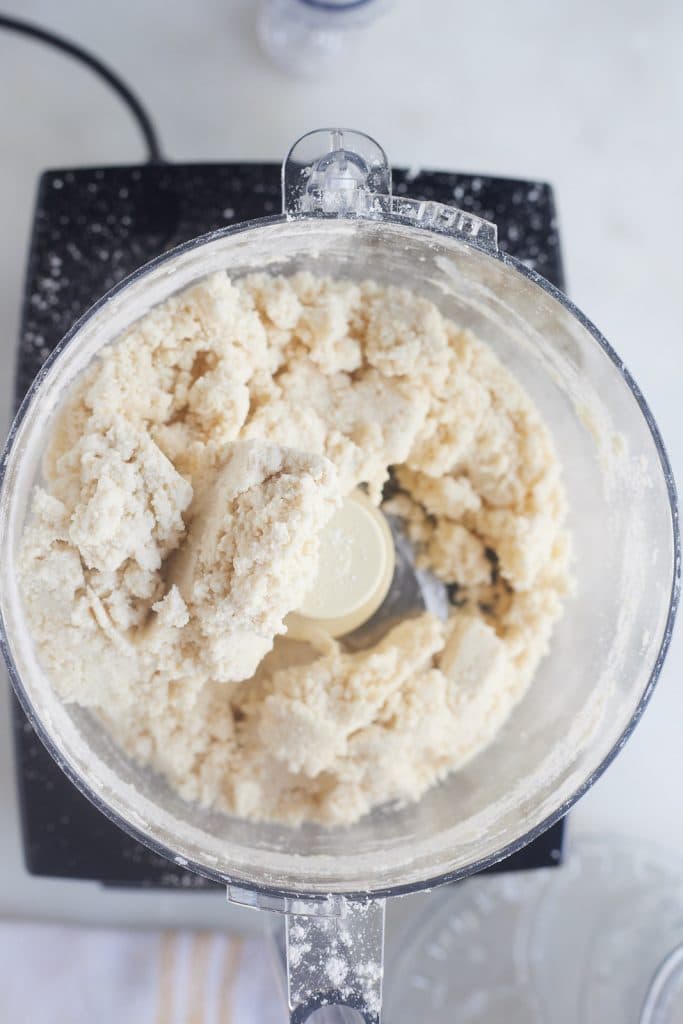 The butter being mixed into the flour.