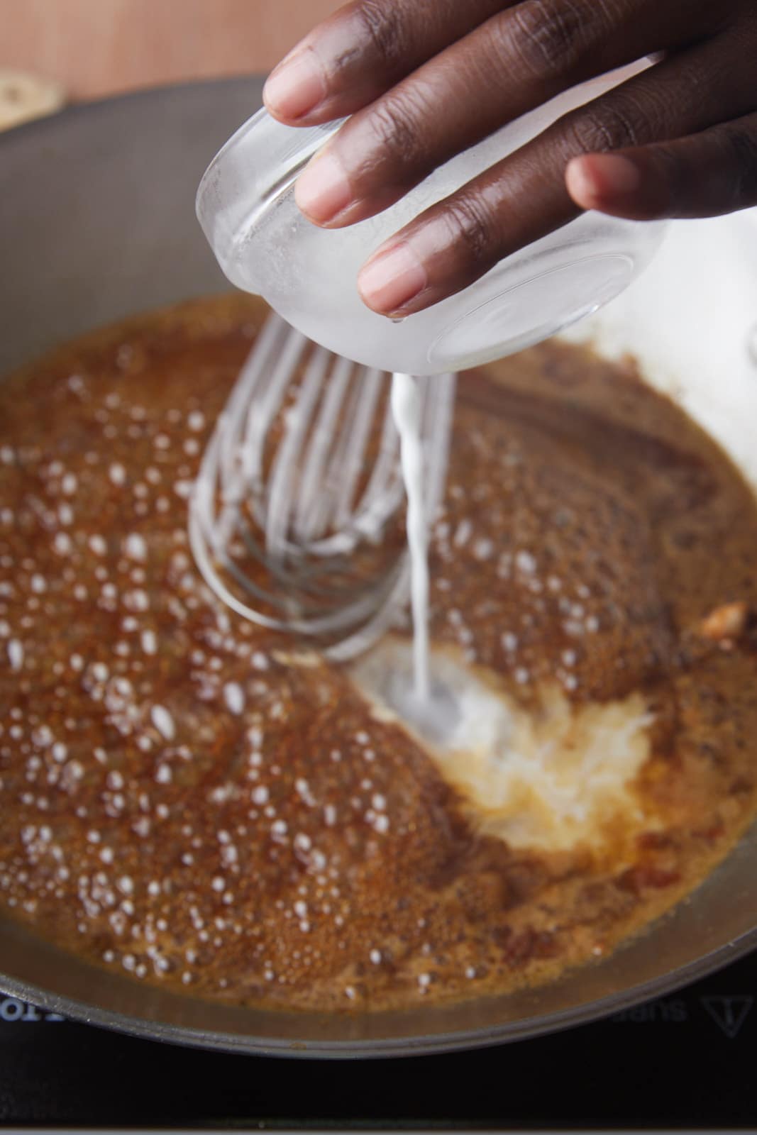 Whisking in the cornstarch mixture.