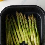 asparagus in an air fryer basket