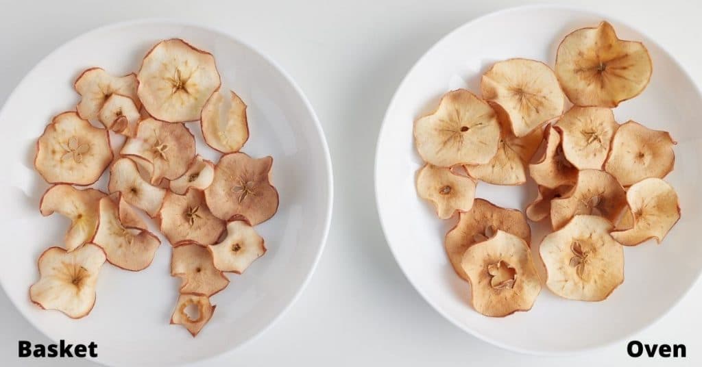 2 white plates with cooked apple chips, text that says basket on left and text that says oven on right