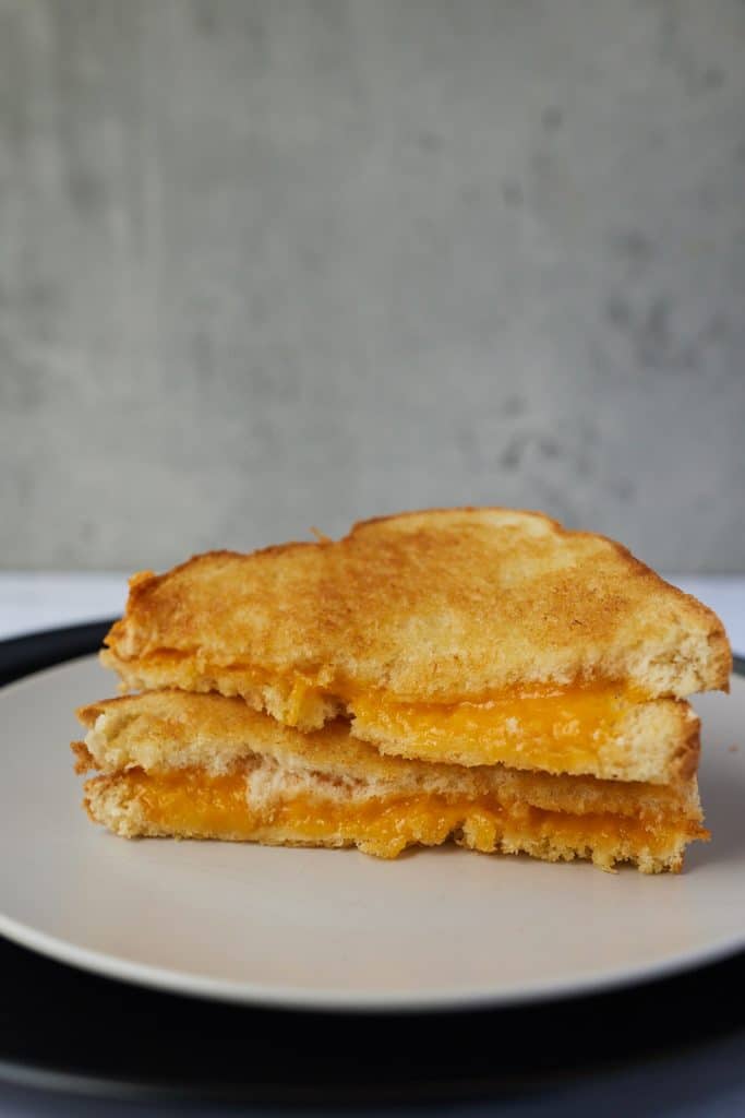 A grilled cheese cut in half.