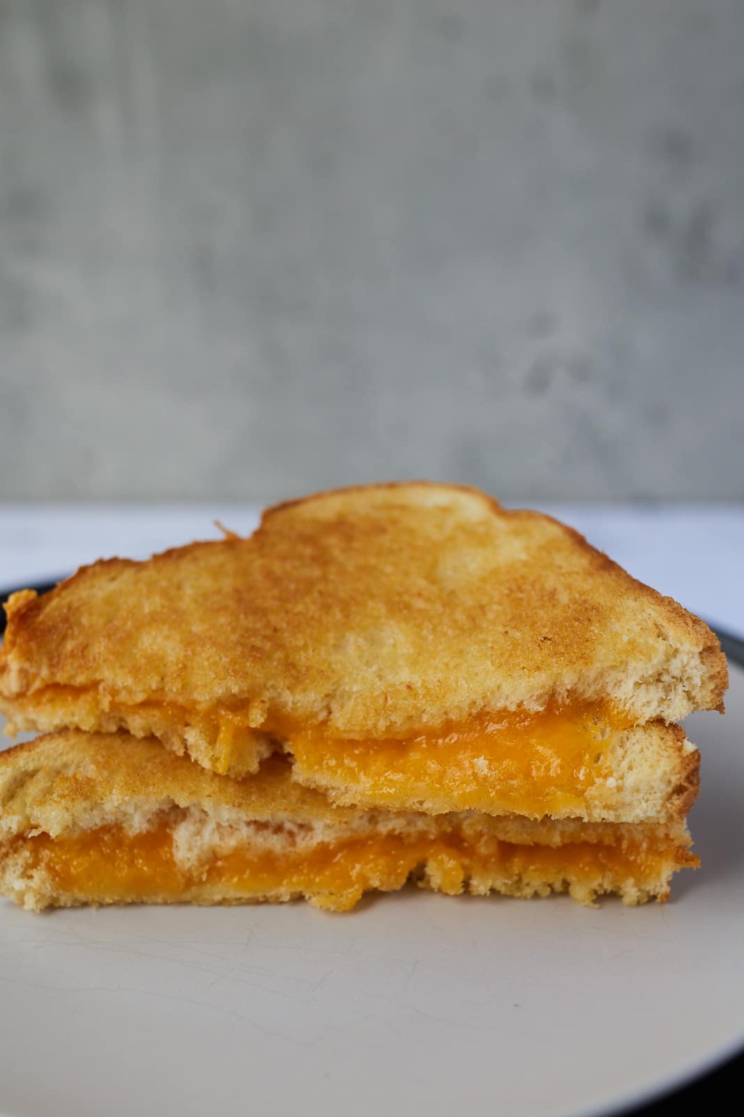 A grilled cheese cut in half.