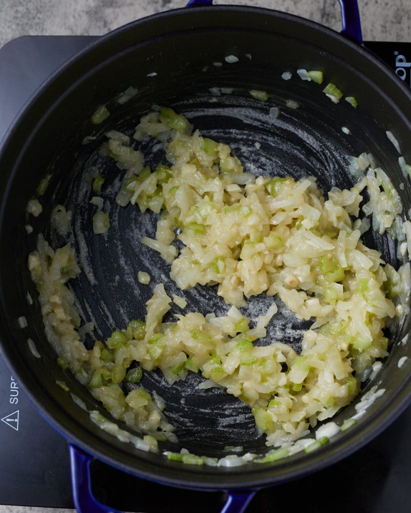onions and celery in pot with flour