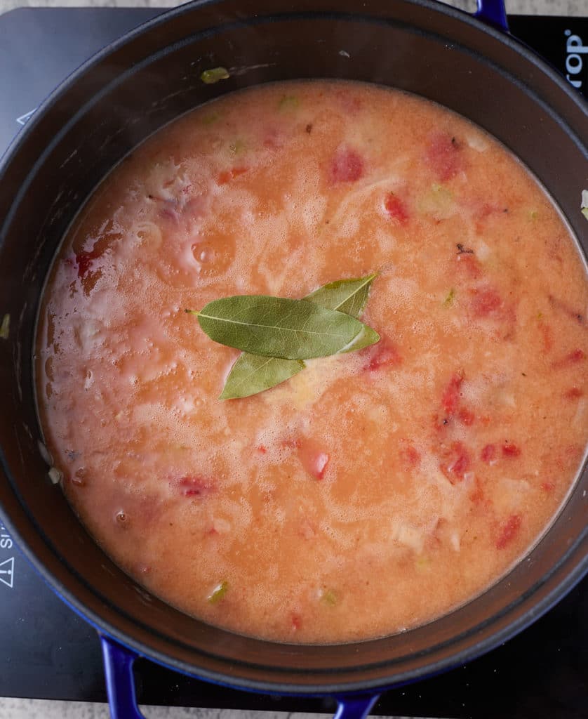 crab bisque ingredients in pot cooking